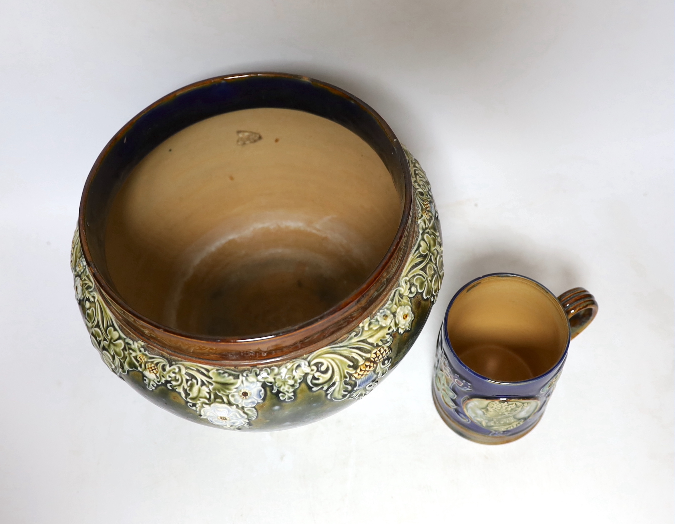 A Royal Doulton Lambeth Edward VII coronation mug and a Royal Doulton jardiniere, 18cm (2)